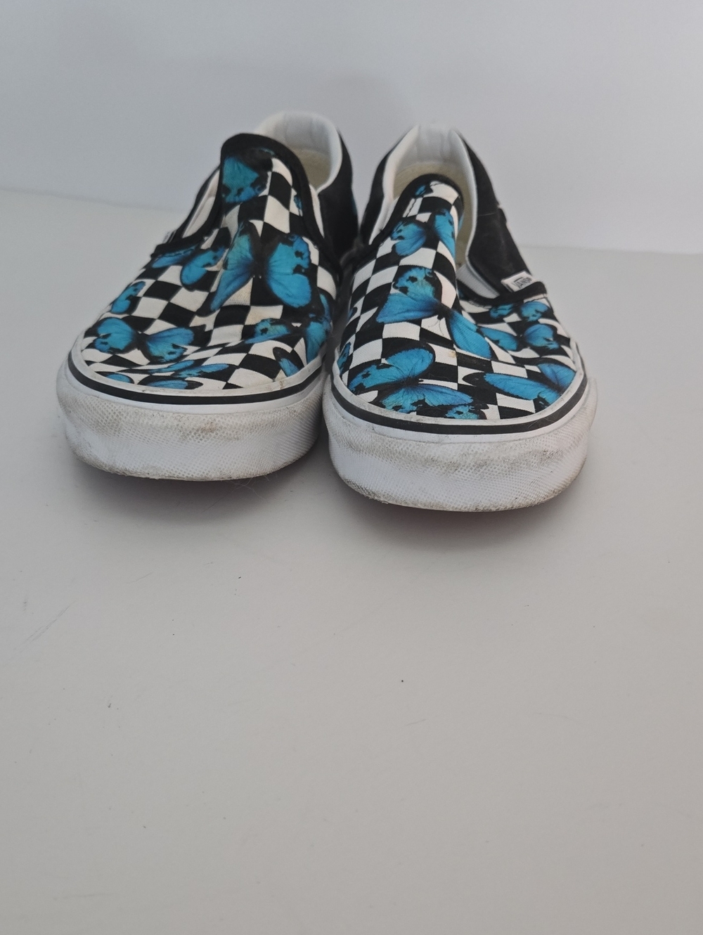 Vans Black & White Checkerboard Slip-Ons with Blue Butterfly Print - Picture 5 of 6